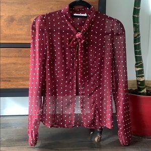Sheer polkadot buttoned blouse.